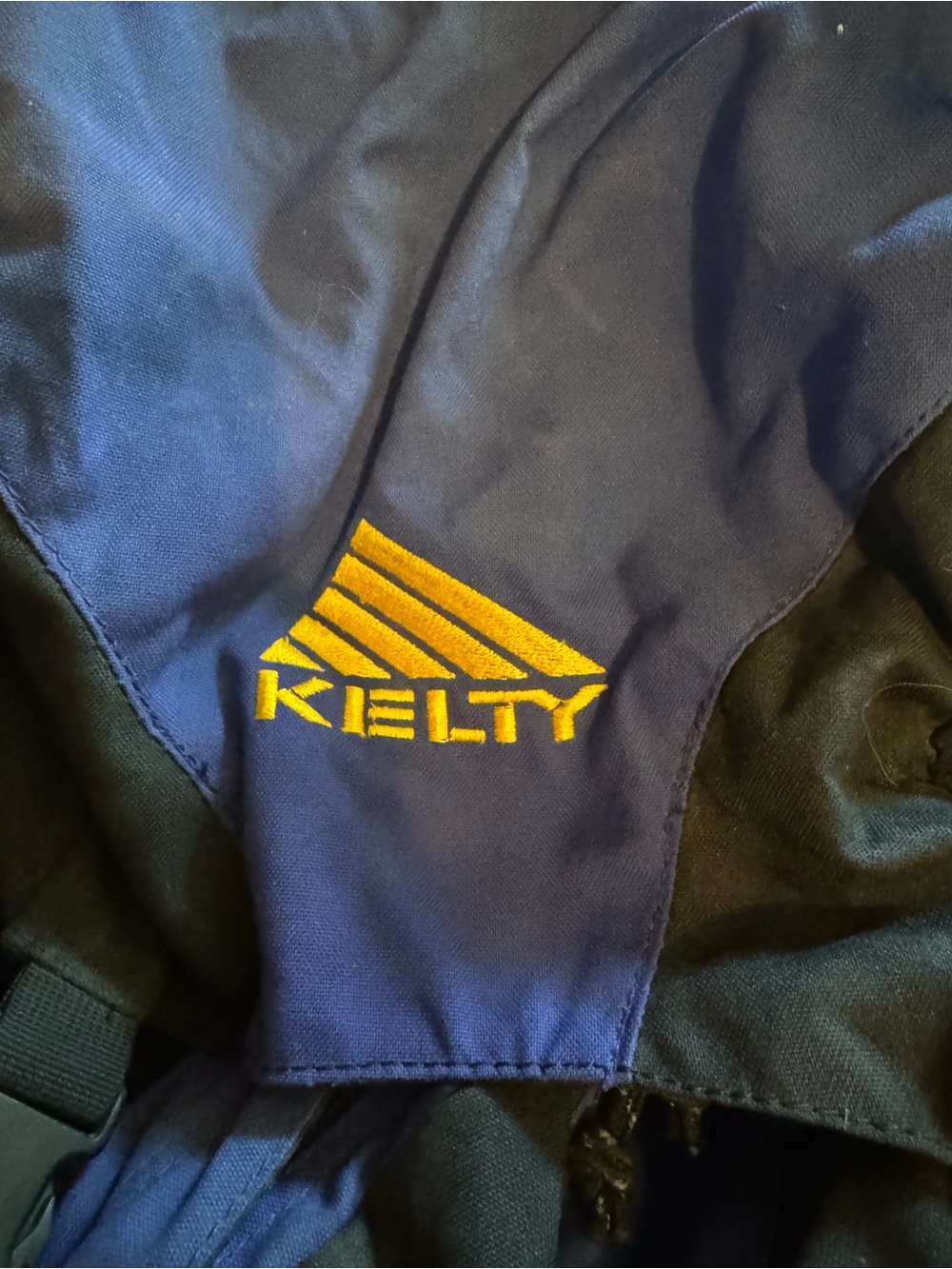 Kelty Men's Blue and Black Backpack with Yellow Logo